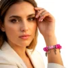 Pink vintage armbånd med charms, perler og vedhæng – håndplukket retro armbånd med nøgle, søstjerne og blomster fra kraemmershop.dk