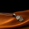 Hamsa-halskæde med blå øje-symbol